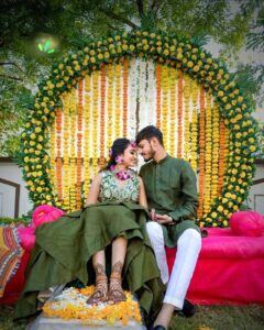 Bride smiling while showing her mehendi design